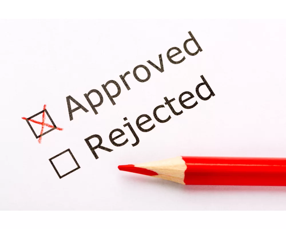 Approved' checkbox marked with a red X next to 'Rejected' checkbox and a red pencil